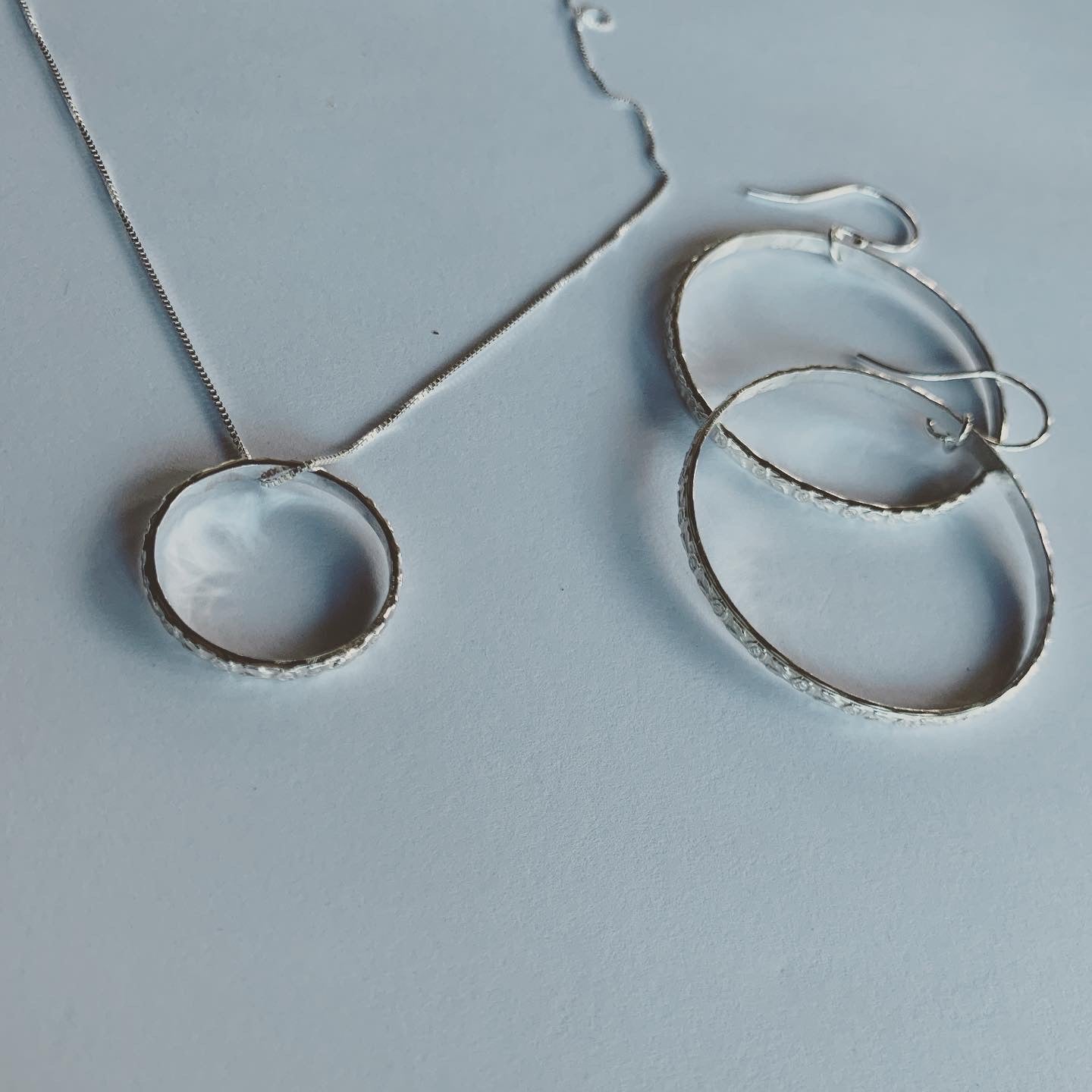 Fine Flower Ring Pendant on a silver curb chain