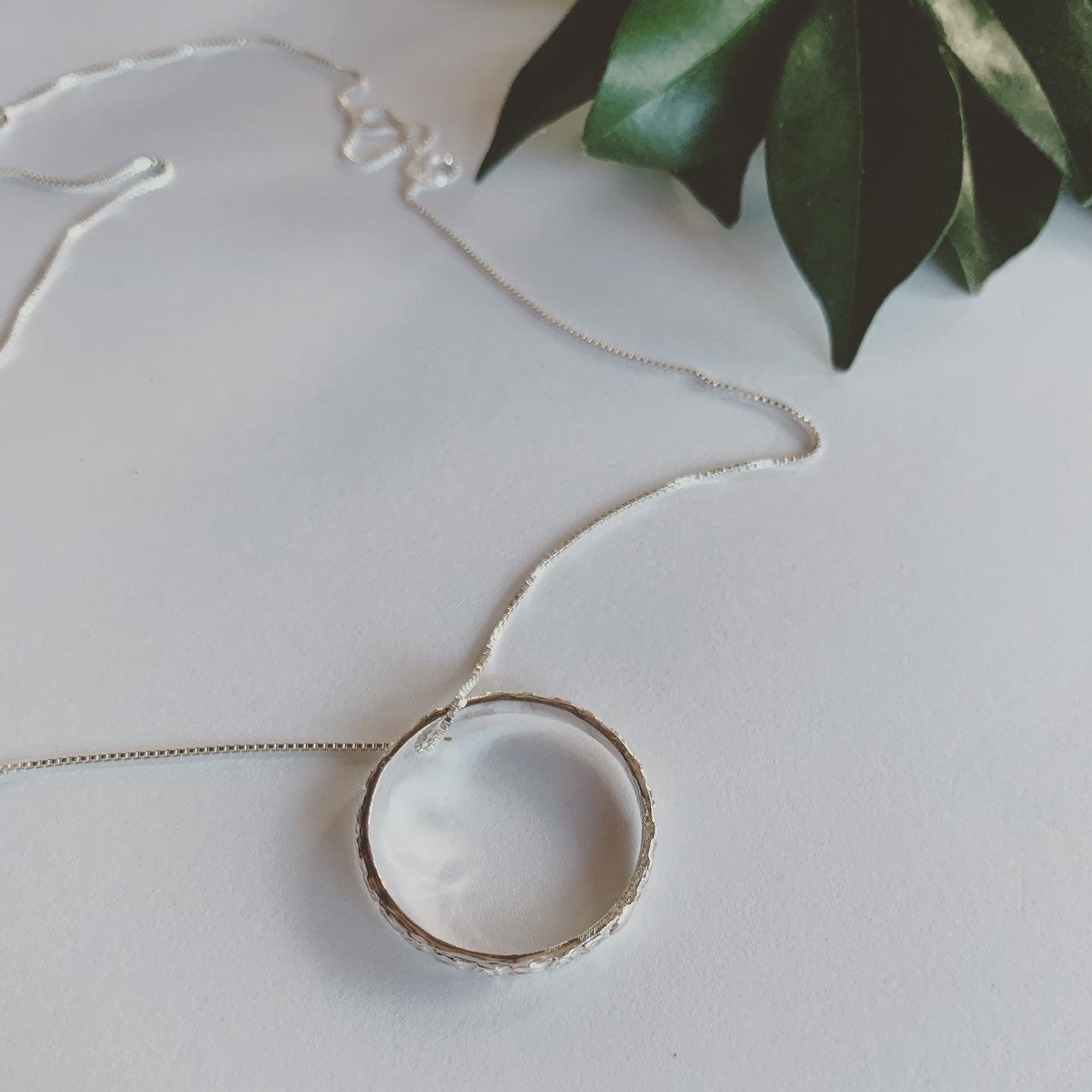 Textured silver ring pendant on Italian box chain. This beauty is complete and serene. Symbolising life's cycles and all that has no beginning and no end. A beautiful symbol of the sacred geometry of life.