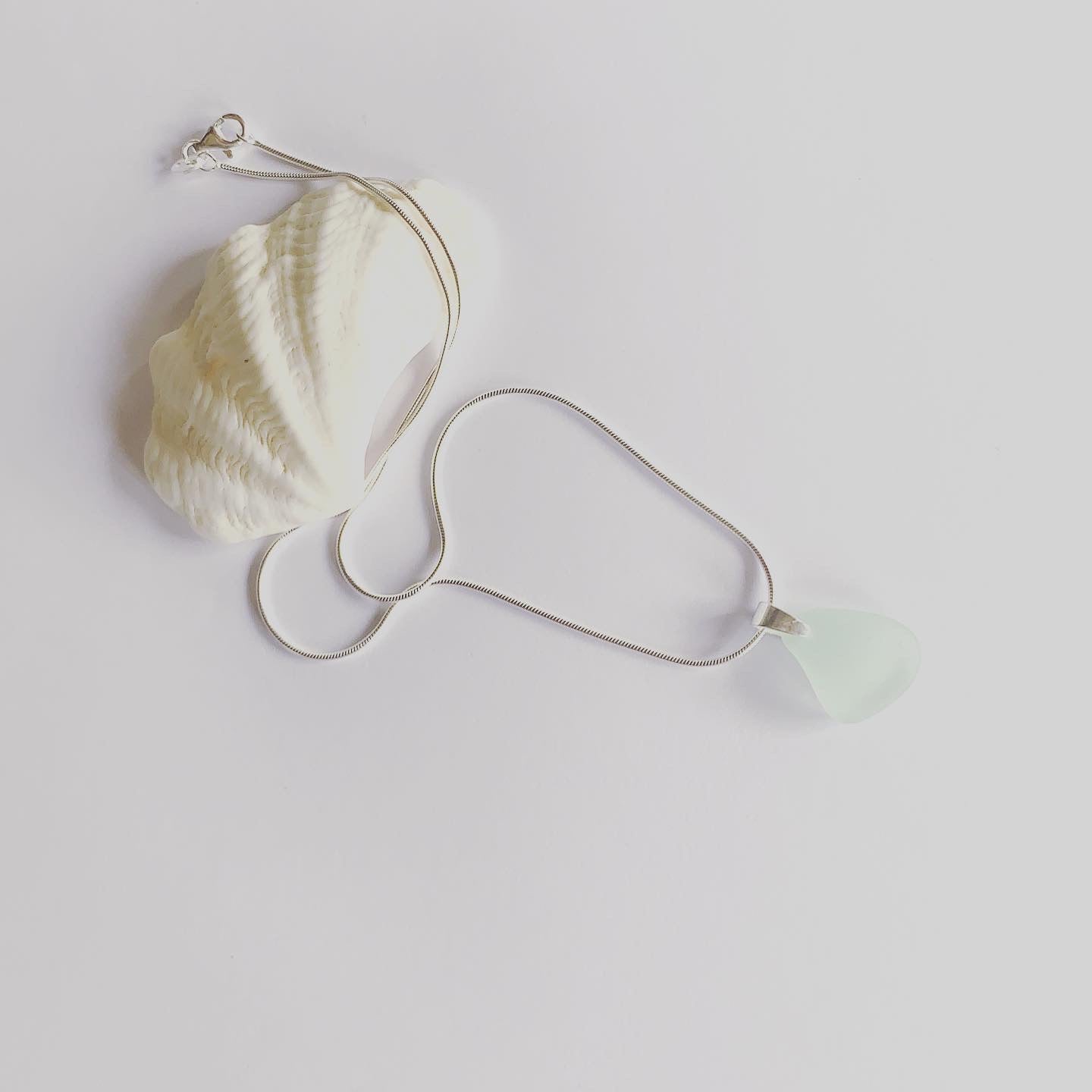 Naturally ocean tumbled sea glass drop pendant on sterling silver chain Sea foam, light aqua sea glass........ ocean light....... ocean feels........ It's the simple things........ creating small intimate moments where one can feel the expansion...... light to wear from ocean to heart💕 Each piece may slightly vary as no piece of beach glass is the same.