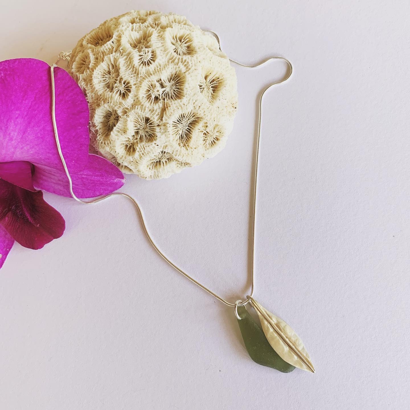 Silver leaf and beach glass pendant. Naturally ocean tumbled beach glass and silver leaf pendant on sterling silver snake chain..... available in 45cm and 50cm sterling silver snake chain. Ocean and Earth🌊🍃 Each piece of natural beach glass may slightly vary, as no piece of beach glass is the same. Unique and of the same quality only the most perfect shaped pieces are used to suit the design and how each piece sits.