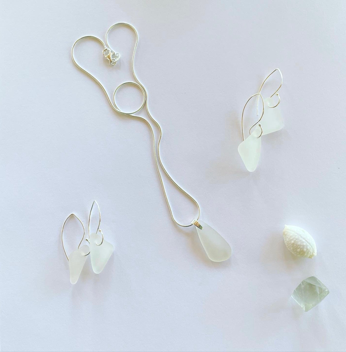 Clear sea glass hues on small wishbone ear hooks in sterling silver. Length 20mm small wishbone