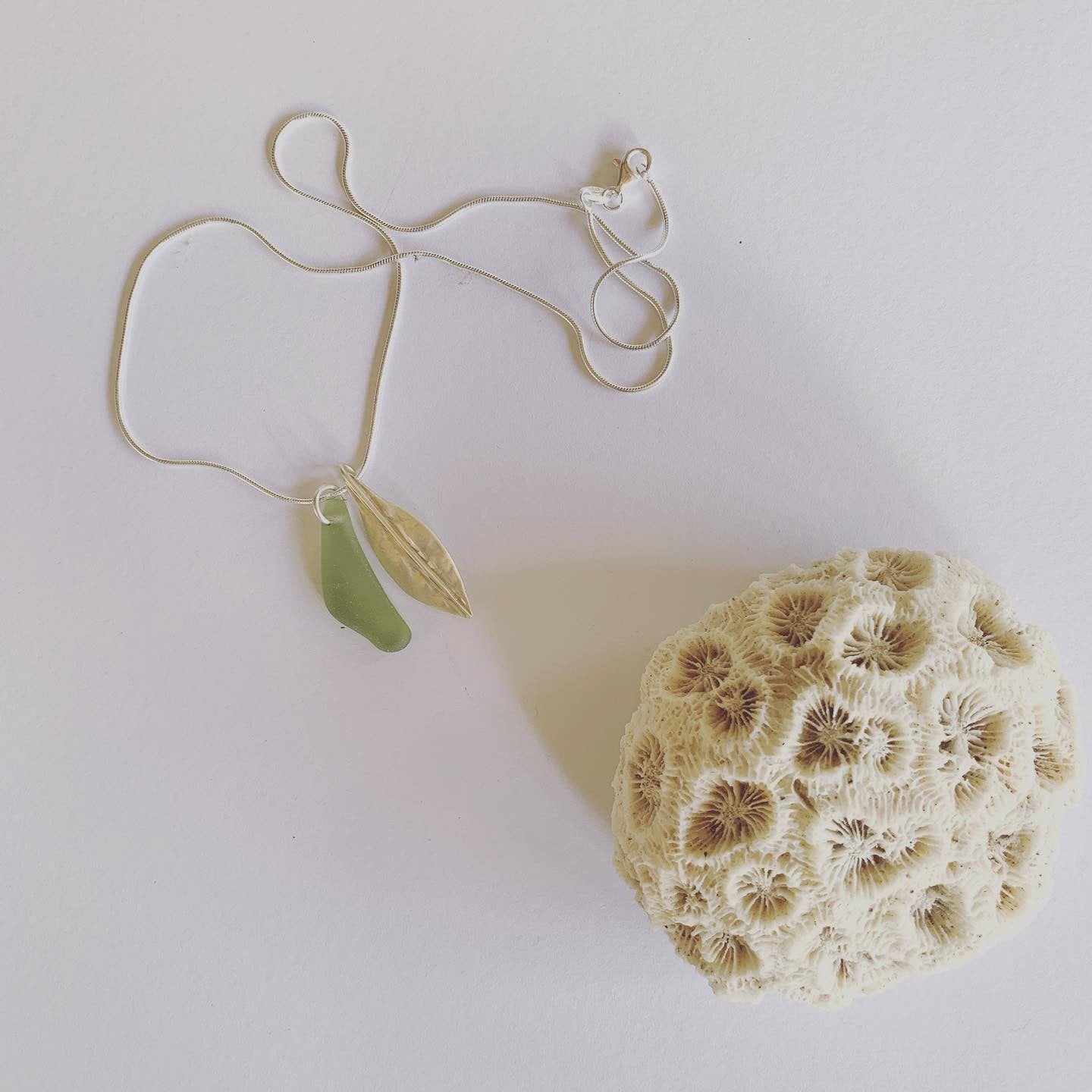 Silver leaf and beach glass pendant. Naturally ocean tumbled beach glass and silver leaf pendant on sterling silver snake chain..... available in 45cm and 50cm sterling silver snake chain. Ocean and Earth🌊🍃 Each piece of natural beach glass may slightly vary, as no piece of beach glass is the same. Unique and of the same quality only the most perfect shaped pieces are used to suit the design and how each piece sits.