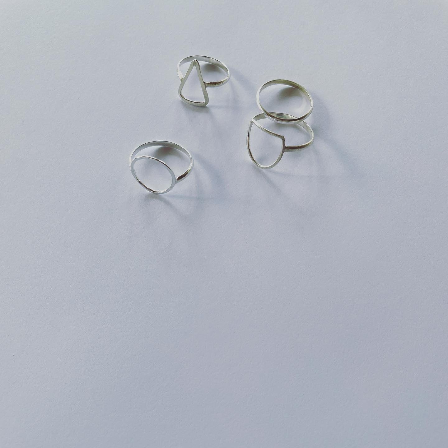 Silver triangle ring.