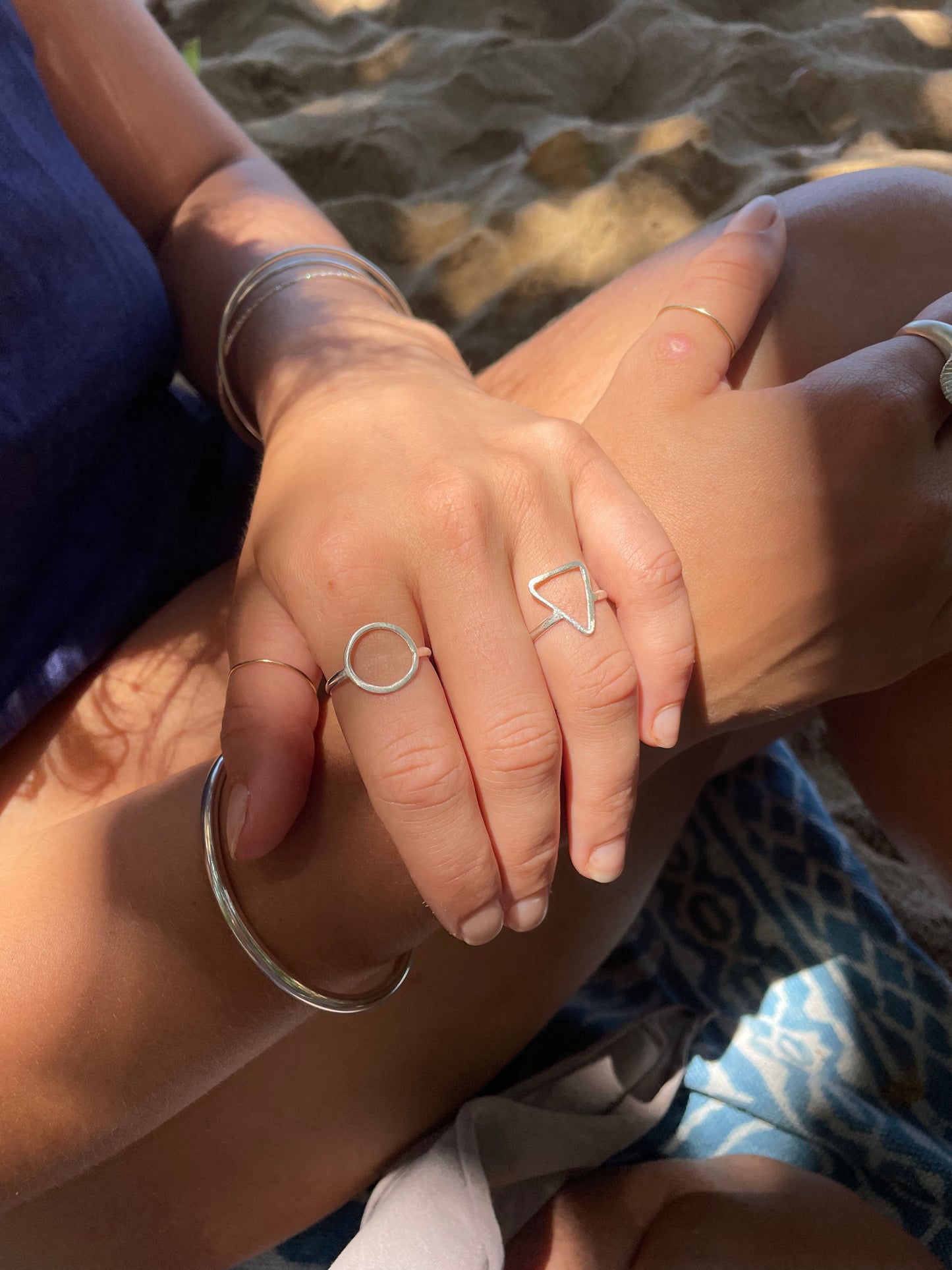 Silver triangle ring.