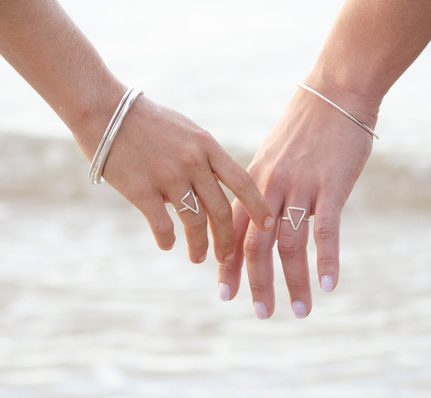 Silver triangle ring.