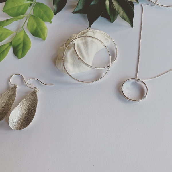 Textured silver hoop earrings on sterling silver ear hooks. These beauties are complete and serene.  Symbolising life's cycles and all that has no beginning and no end.  A beautiful symbol of the sacred geometry of life.  Handmade with love.  2.2mm solid sterling silver texture, in 4cm hoops.