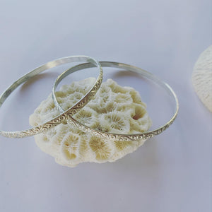 Sterling silver textured bangle. This textured beauty is funky and its silver!!  To add to those forever pieces.........  Made to last and made to love💓  Great as a trio, on it's own or mix it up with our different size solid sterling silver bangles.  It is a 4mm thick sterling silver bangle.  The inner diameter is 63mm.
