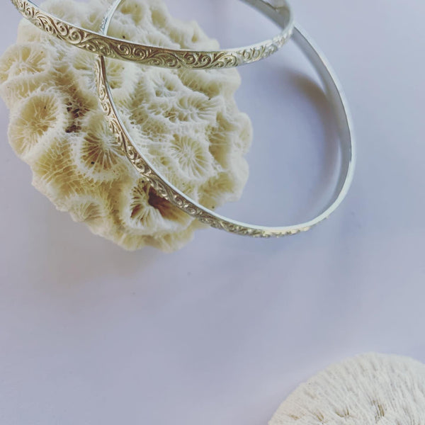 Sterling silver textured bangle. This textured beauty is funky and its silver!!  To add to those forever pieces.........  Made to last and made to love💓  Great as a trio, on it's own or mix it up with our different size solid sterling silver bangles.  It is a 4mm thick sterling silver bangle.  The inner diameter is 63mm.