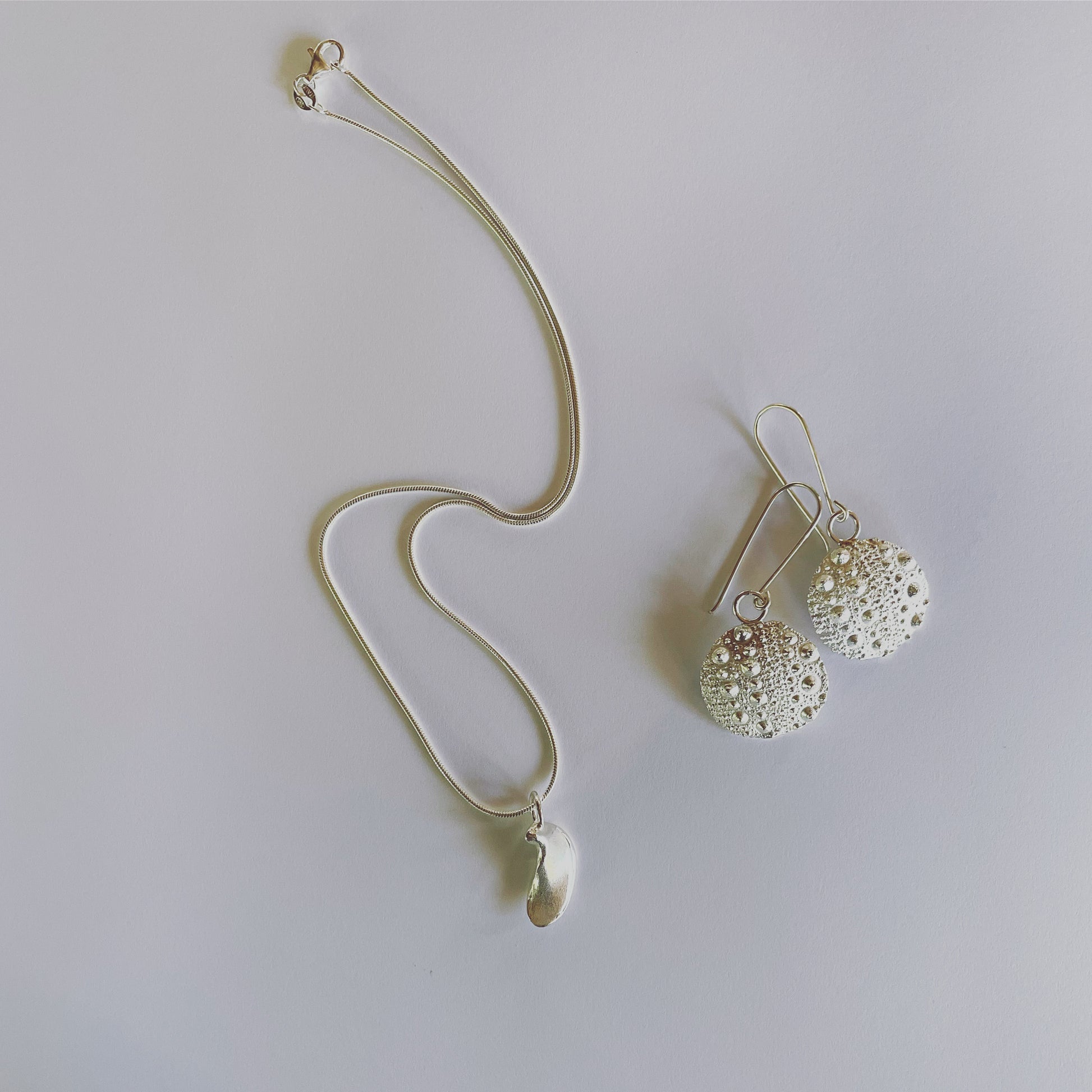Neive earrings in silver, Sea Urchin earrings with Nimüe pendant