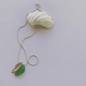 Silver leaf and beach glass pendant. Naturally ocean tumbled beach glass and silver leaf pendant on sterling silver snake chain..... available in 45cm and 50cm sterling silver snake chain.  Ocean and Earth🌊🍃  Each piece of natural beach glass may slightly vary, as no piece of beach glass is the same. Unique and of the same quality only the most perfect shaped pieces are used to suit the design and how each piece sits. 