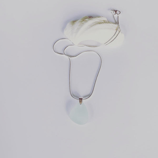 Naturally ocean tumbled sea glass drop pendant on sterling silver chain   Sea foam, light aqua sea glass........ ocean light....... ocean feels........  It's the simple things........ creating small intimate moments where one can feel the expansion...... light to wear from ocean to heart💕  Each piece may slightly vary as no piece of beach glass is the same. 