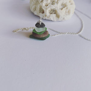 Naturally ocean tumbled beach glass and beach pebble serenity stack on 60cm sterling silver fine chain......  Ocean breath and ocean love earthed in this neck piece.  Balance, calm and feeling centred........  Each piece of natural beach glass may slightly vary, as no piece of beach glass is the same. Unique and of the same quality only the most perfect shaped pieces are used to suit the design and how each piece sits. 